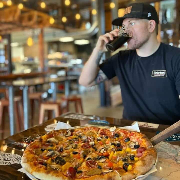 Our very own Carson enjoying a Trails End Pizza he made and  a Char Falls Porter.  C…